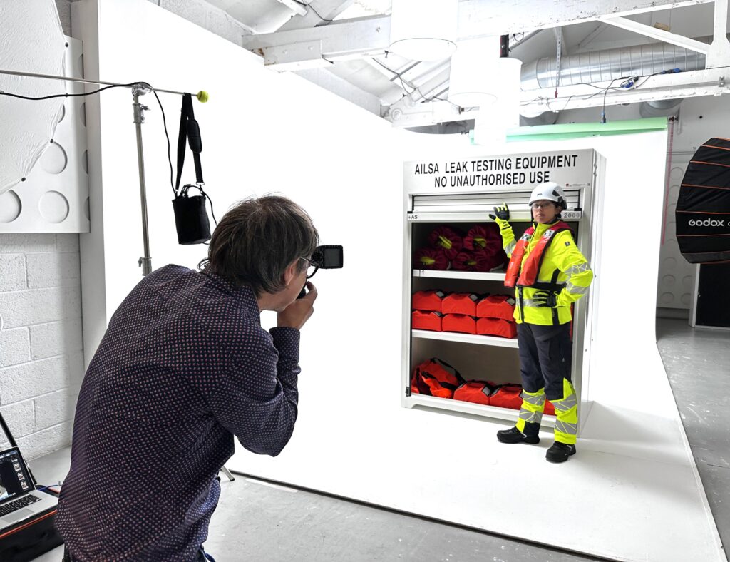 Marcus taking stills of the RS300.950 filled with immersion suits and lifejackets.