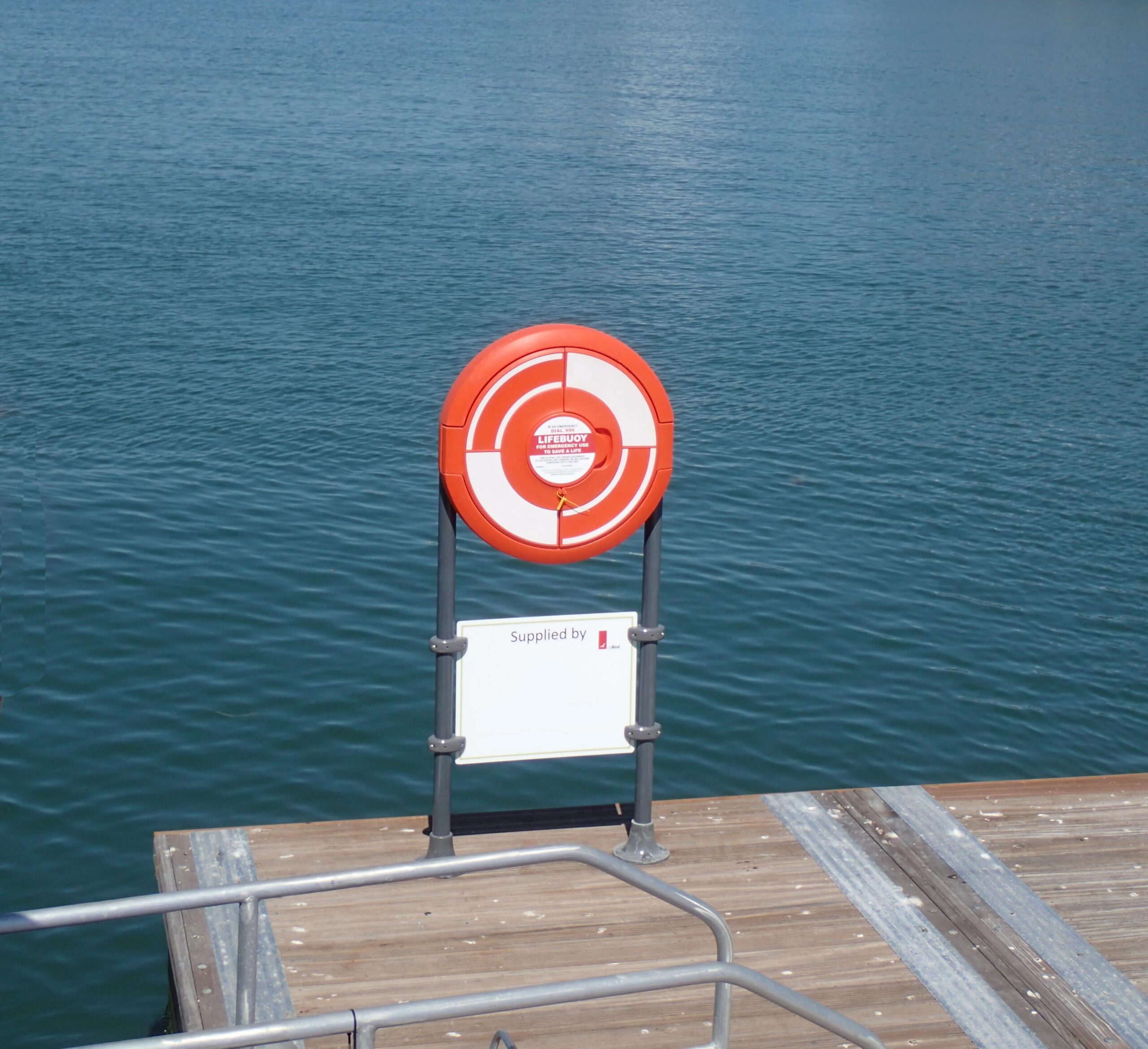 SOS700 22" Lifebuoy housing by JoBird. Shown supported by optional GRP posts on a pontoon