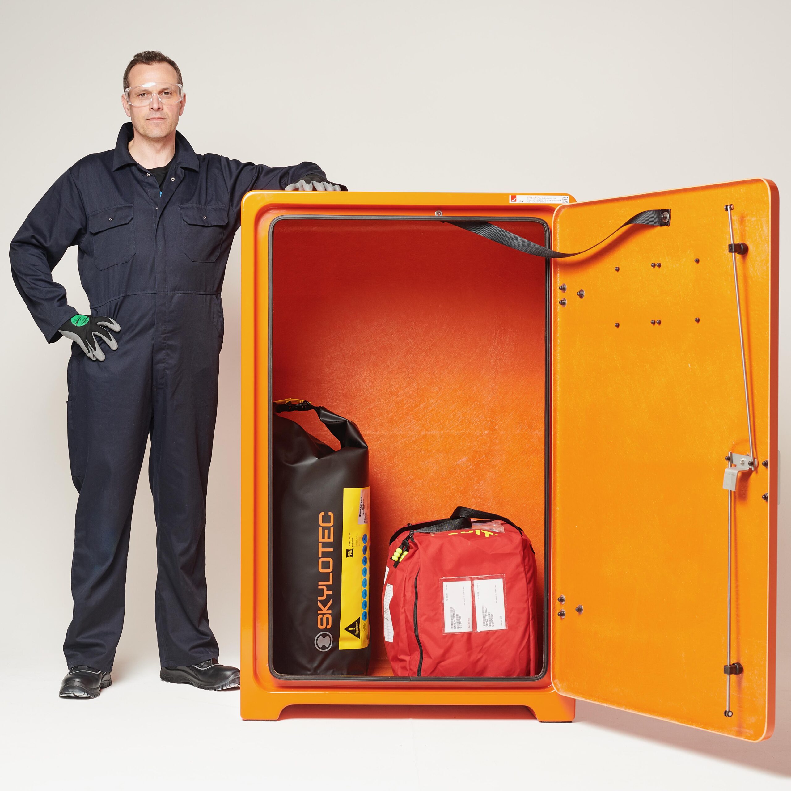 JB29 with door open with a descent device and immersion suits inside.