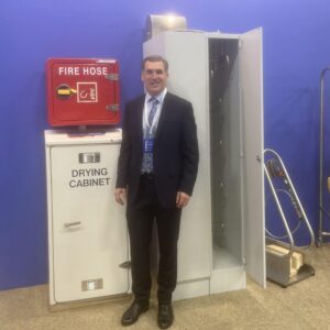 Nick at Europort in November 2021 stood next to two of the dryng cabinet options